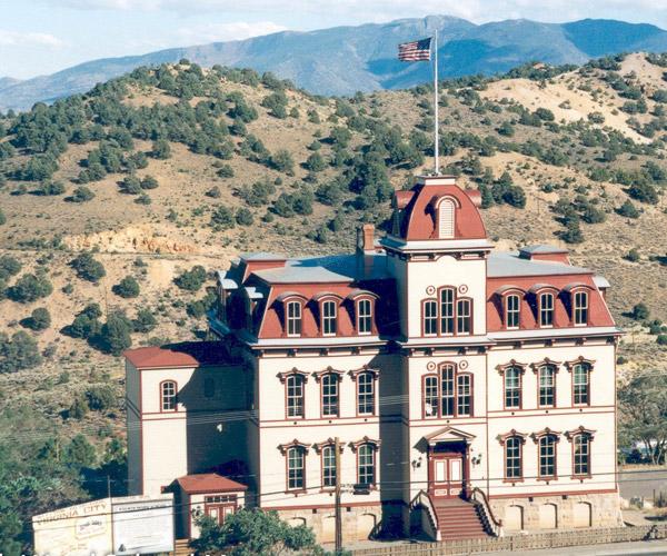 The restored Fourth Ward School museum building today, photographed in color against the surrounding hills