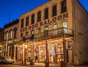 The Red Dog Saloon on North C Street in Virginia City, Nevada, lit up in the evening